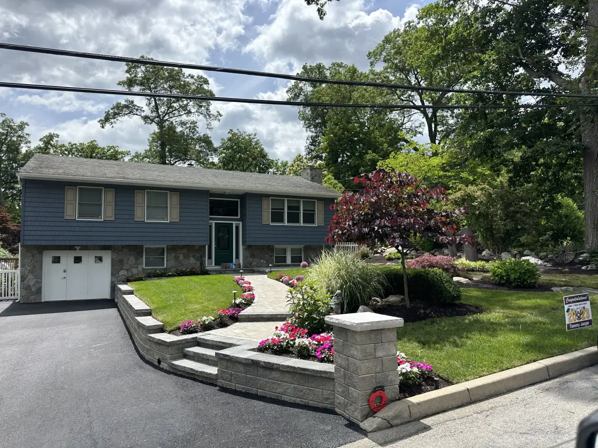Fertilized green lawn maintained by Bernicker and Son in Newburgh NY